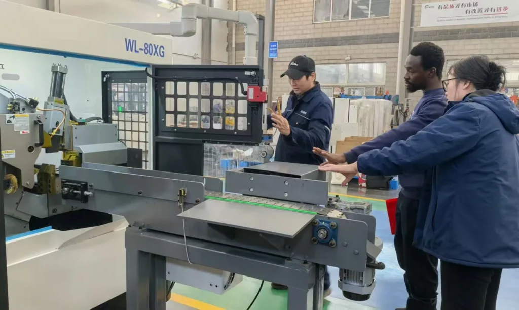 Customers inspecting WANLI circular saw equipment at the factory